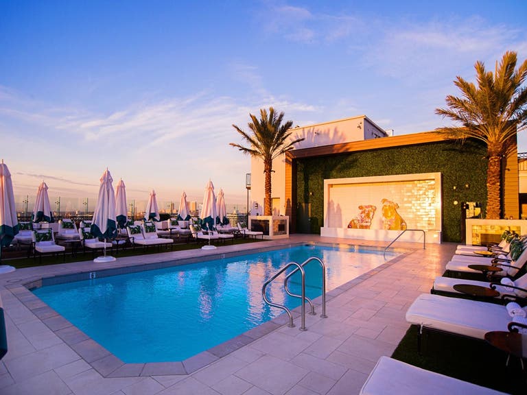 The London West Hollywood rooftop pool at sunset